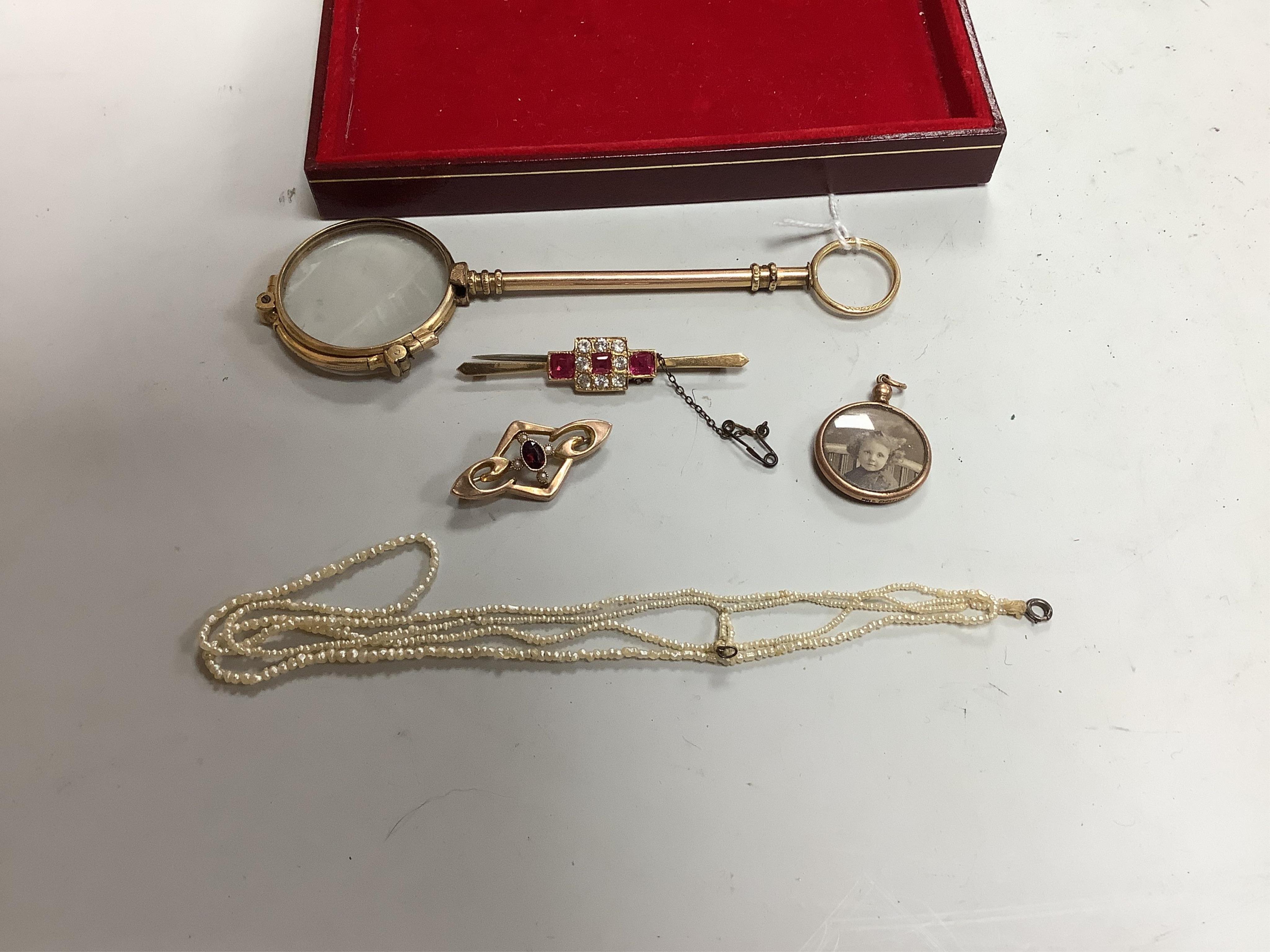 A collection of jewels, comprising: an Art Deco synthetic ruby and paste bar brooch, mounted in gold, length 6cm, gross weight approximately 5.5 grams, an Edwardian garnet and seed pearl brooch in gold, stamped 9ct, gros